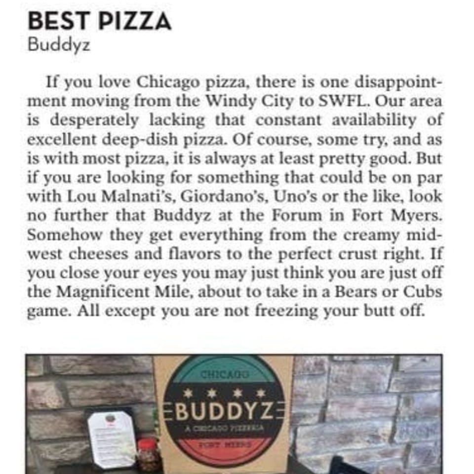A Buddyz Chicago Pizzeria box with a teal and red logo, next to a white paper menu.